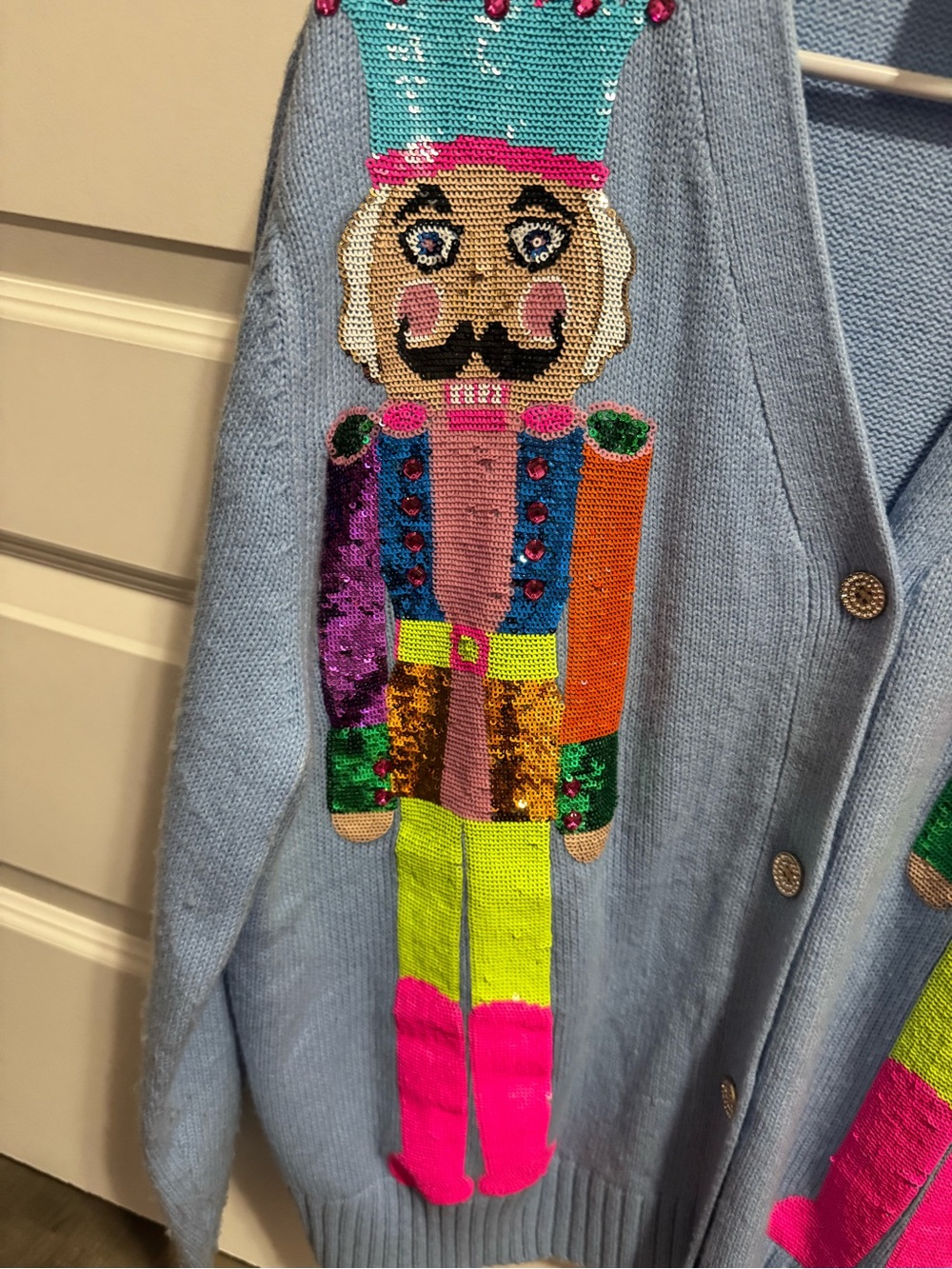 Light Blue Cardigan Sweater with Colorful Nutcracker Sequin Design - Picture 3 of 9